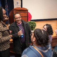 woman talking with small group